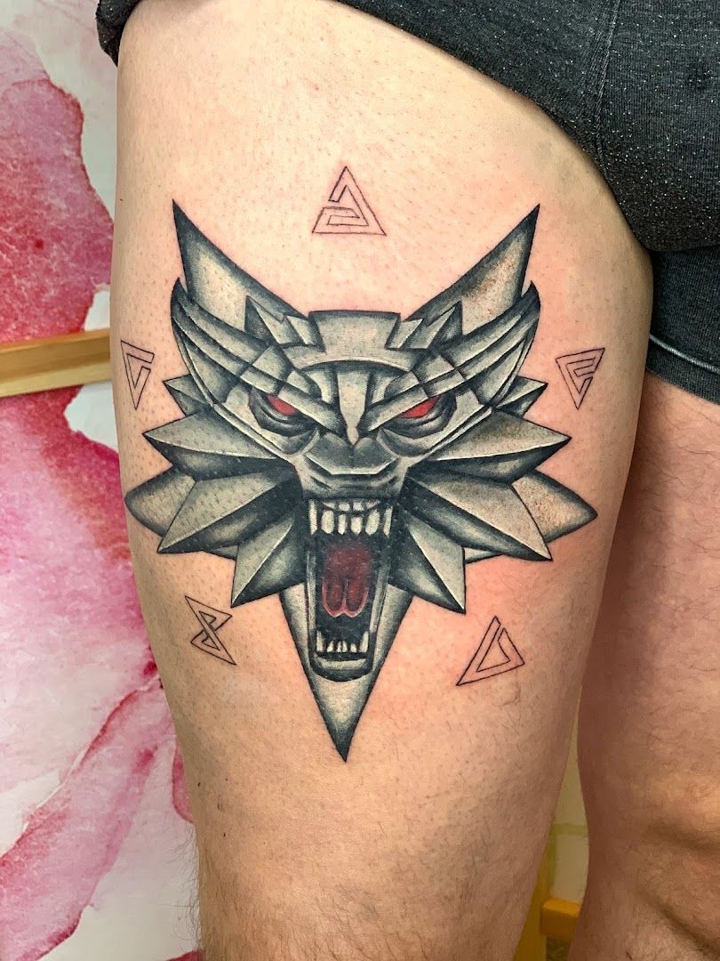 a cover-up tattoo of a wolf with a red eye and a black and white design, rhein-pfalz-kreis, germany