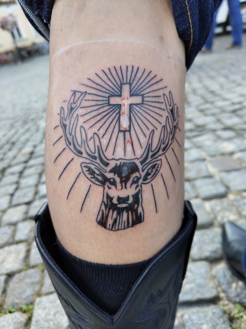 a narben tattoo of a deer with a sun on it, vorpommern-greifswald, germany