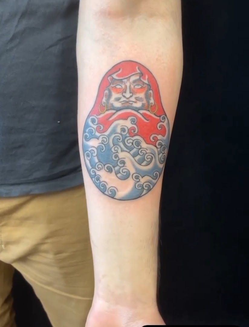 a narben tattoo of a red and blue tattoo on the arm, berlin, germany