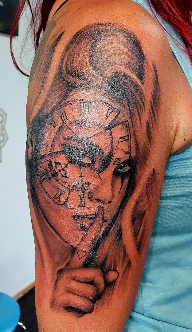 a woman with a clock cover-up tattoo on her shoulder, ansbach, germany