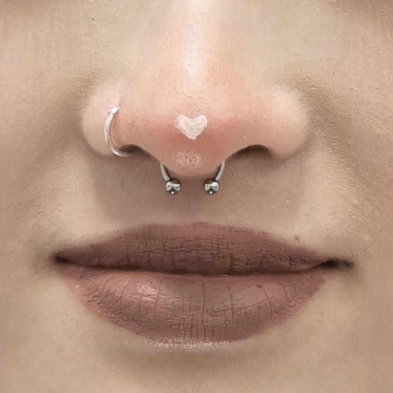 a woman with a nose piercing