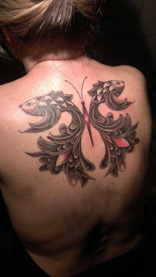 a woman with a cover-up tattoo on her back, mittelsachsen, germany
