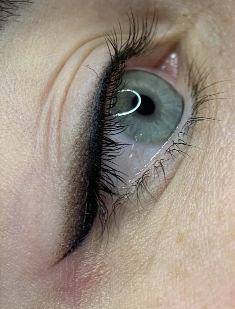 a woman's eye with long eyelashes