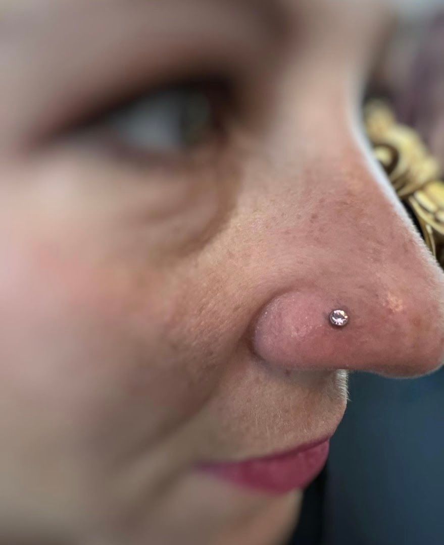 a woman with a nose piercing