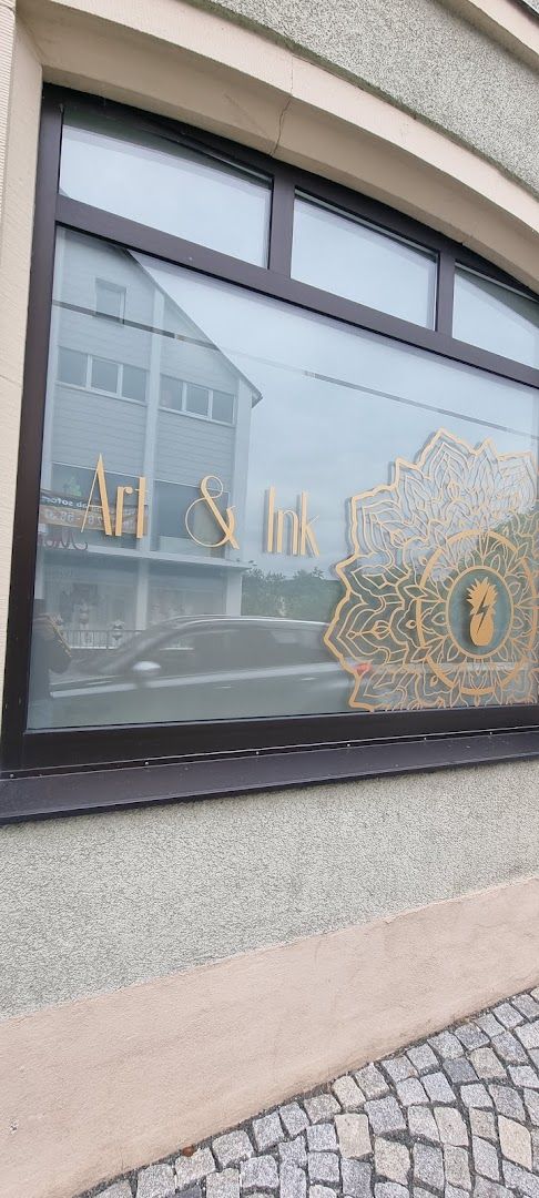 a window with a gold flower on it