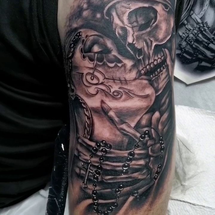 a man with a skull cover-up tattoo on his arm, kassel, germany