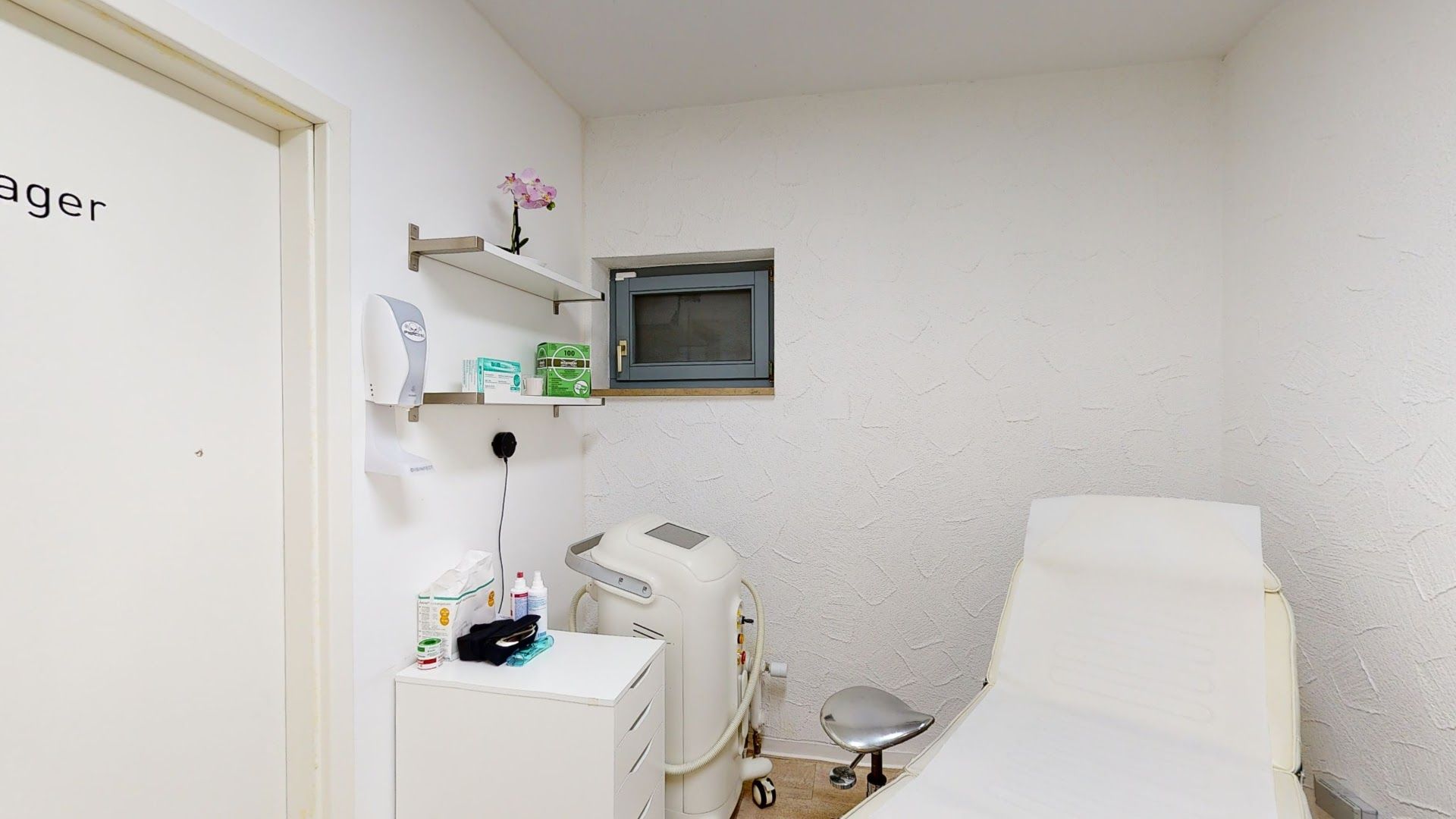 a room with a bed and a microwave