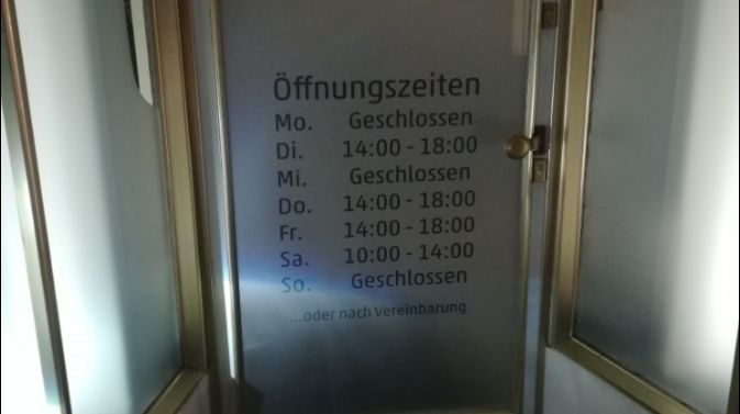 a door with a sign on it that says,