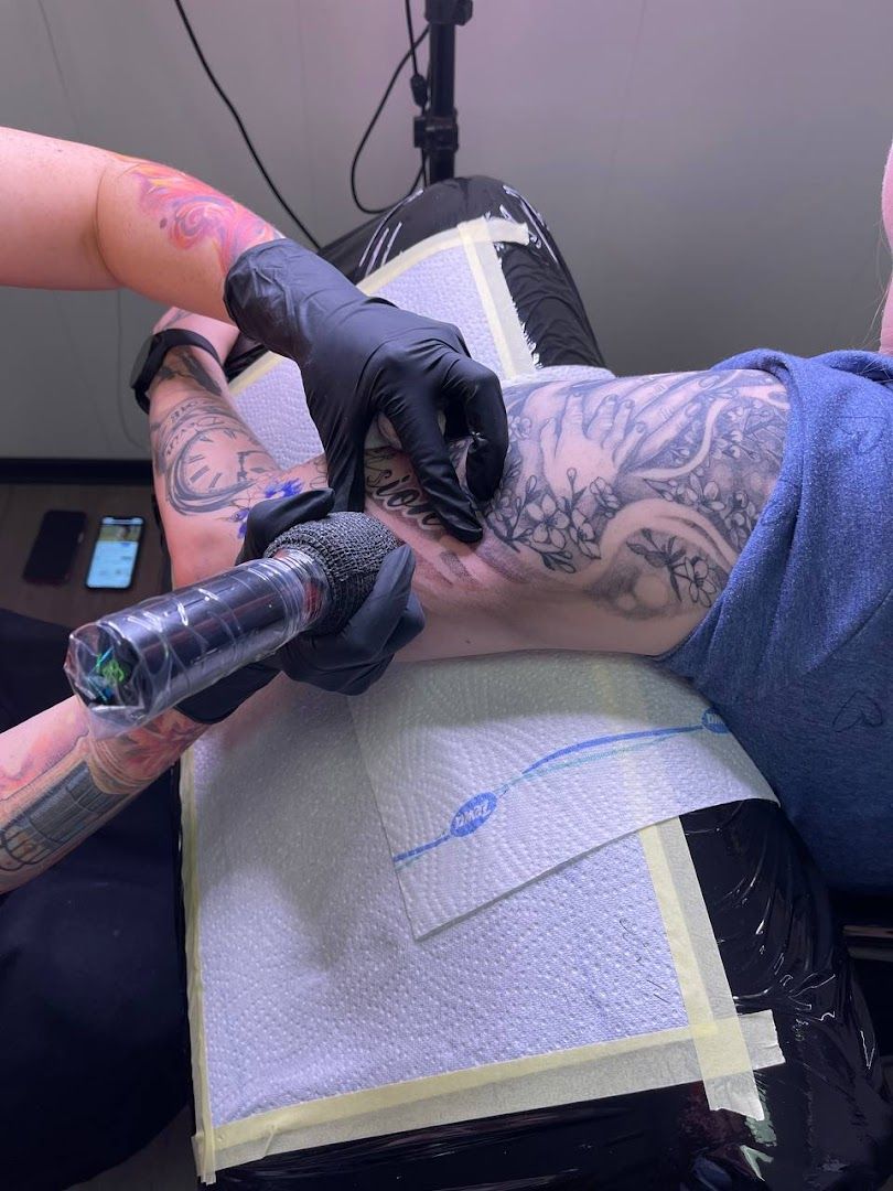 a man getting his portrait tattoos done by a tattoo artist, berlin, germany