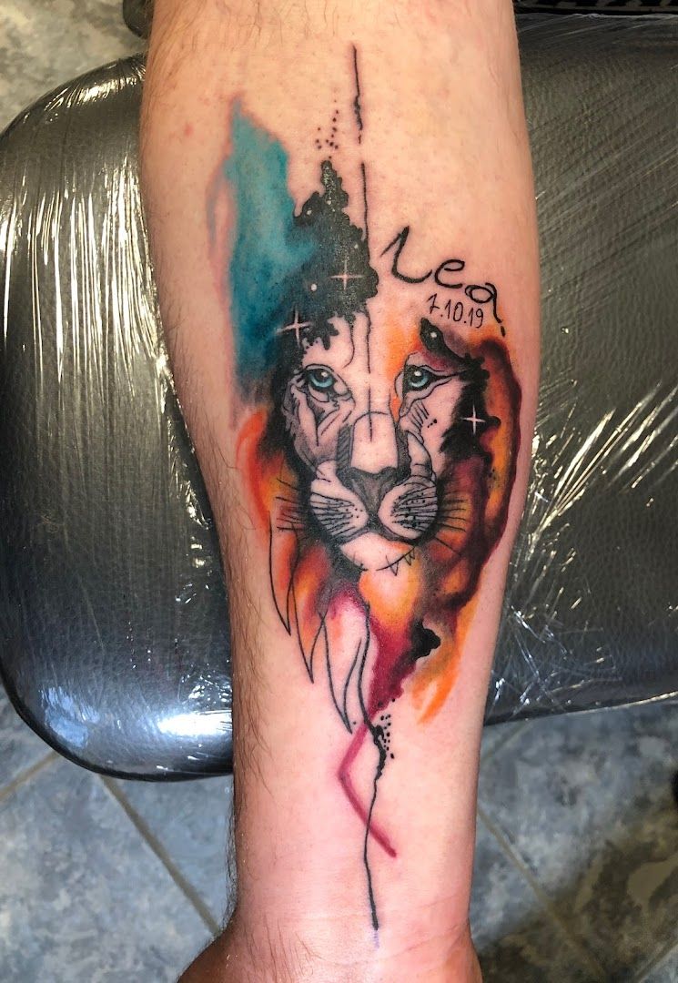 a cover-up tattoo of a lion with a crown on its head, neu-ulm, germany
