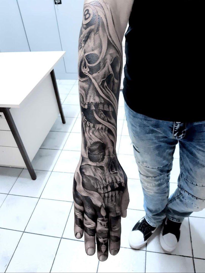 a man with a cover-up tattoo on his arm, aichach-friedberg, germany