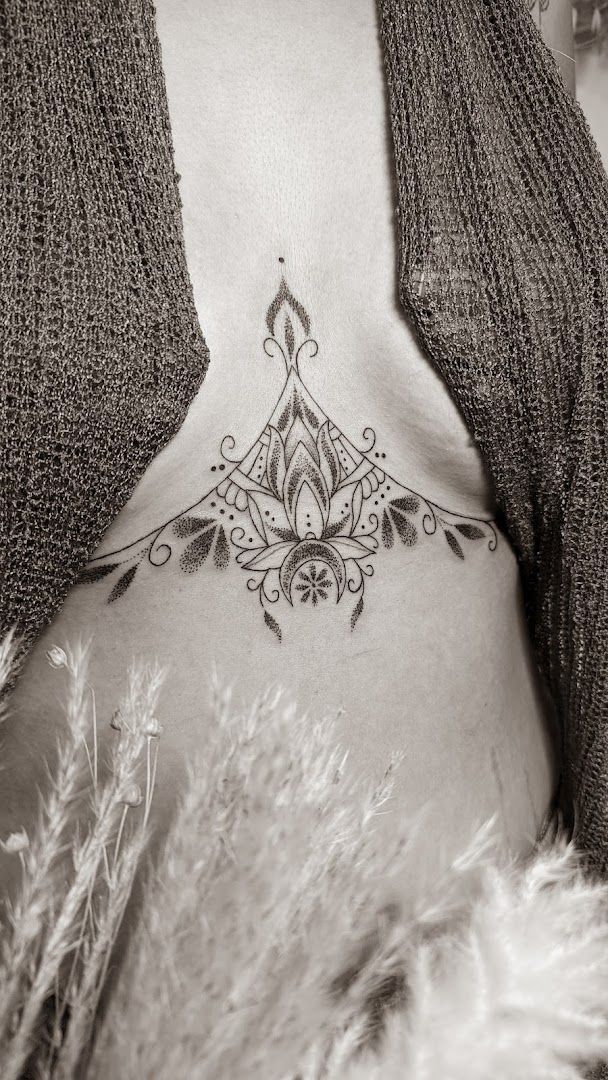 a woman with a narben tattoo on her chest, vulkaneifel, germany