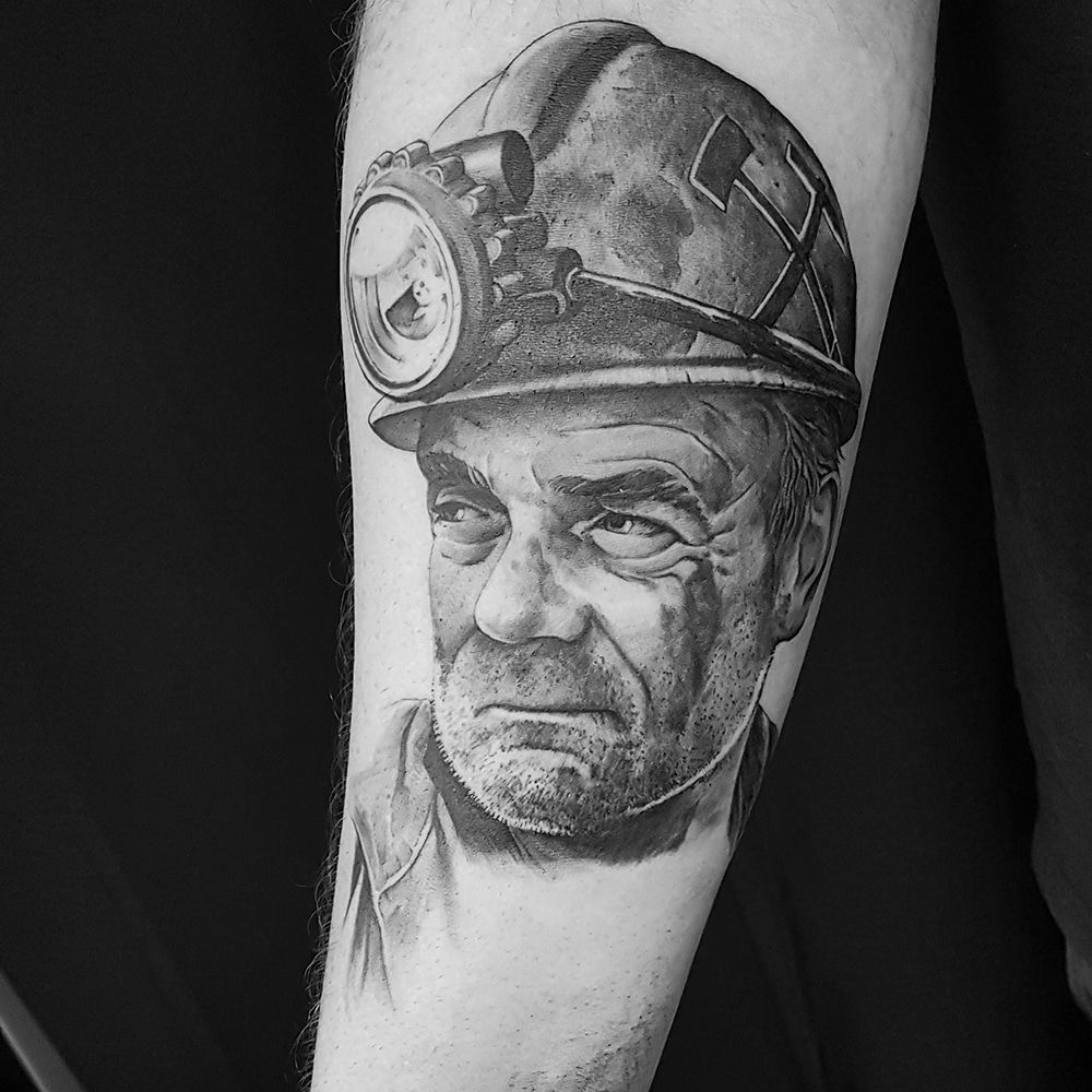 a man with a helmet on his arm