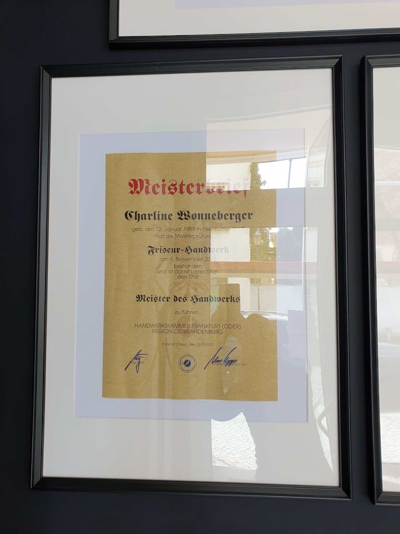 a framed photograph of a man's certificate