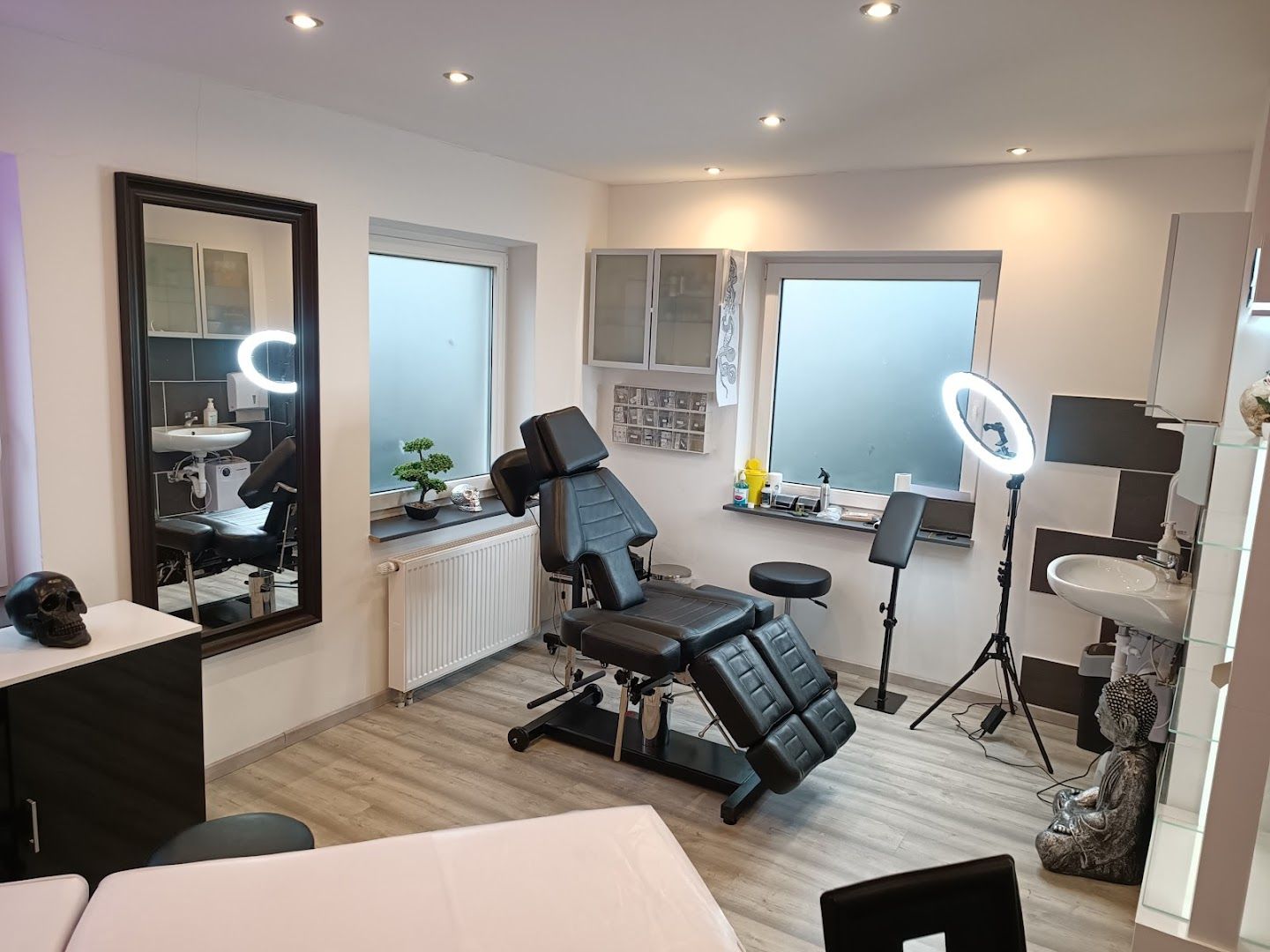 a salon room with a chair and a mirror