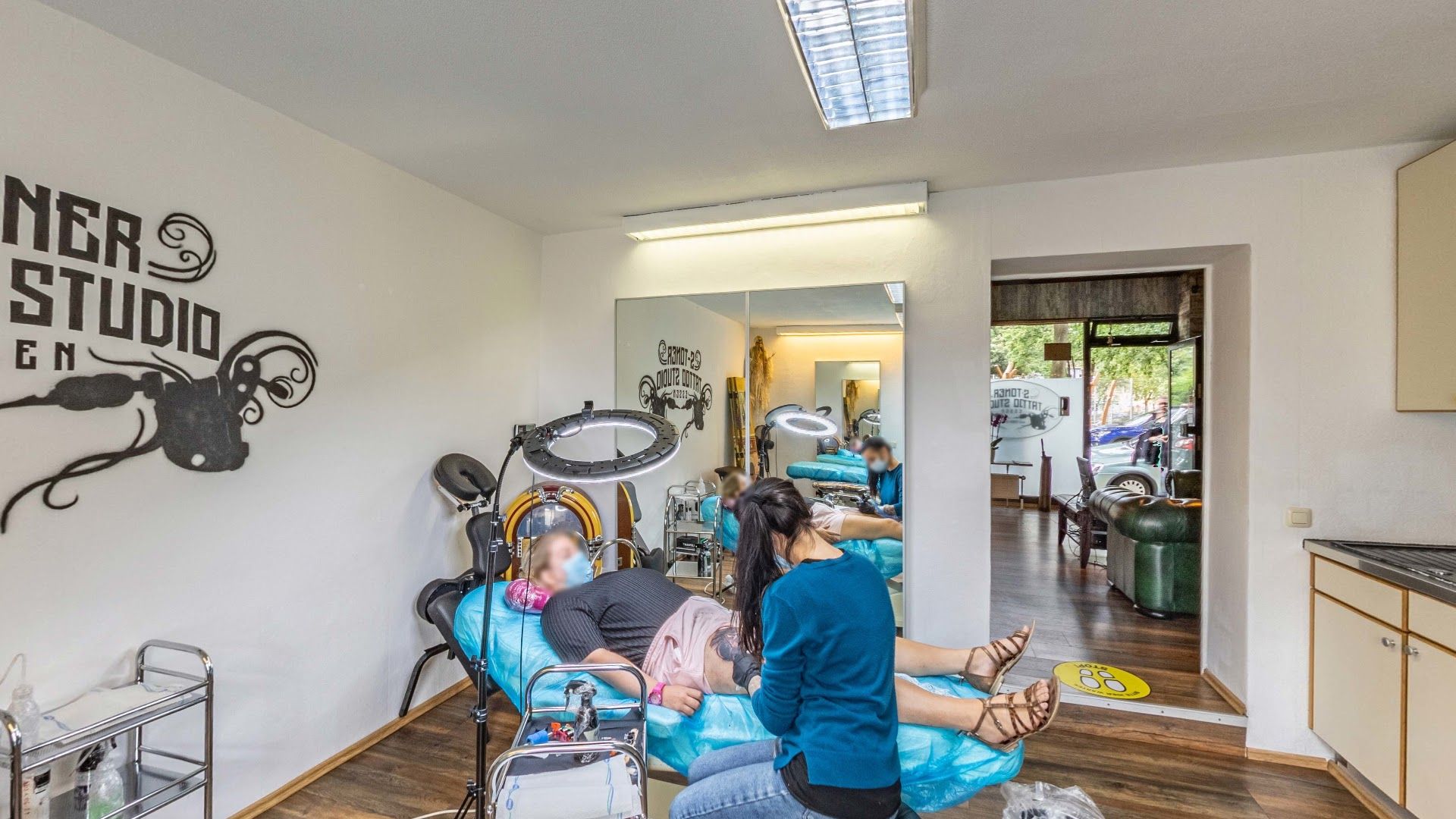 a woman sitting in a chair in a dental room