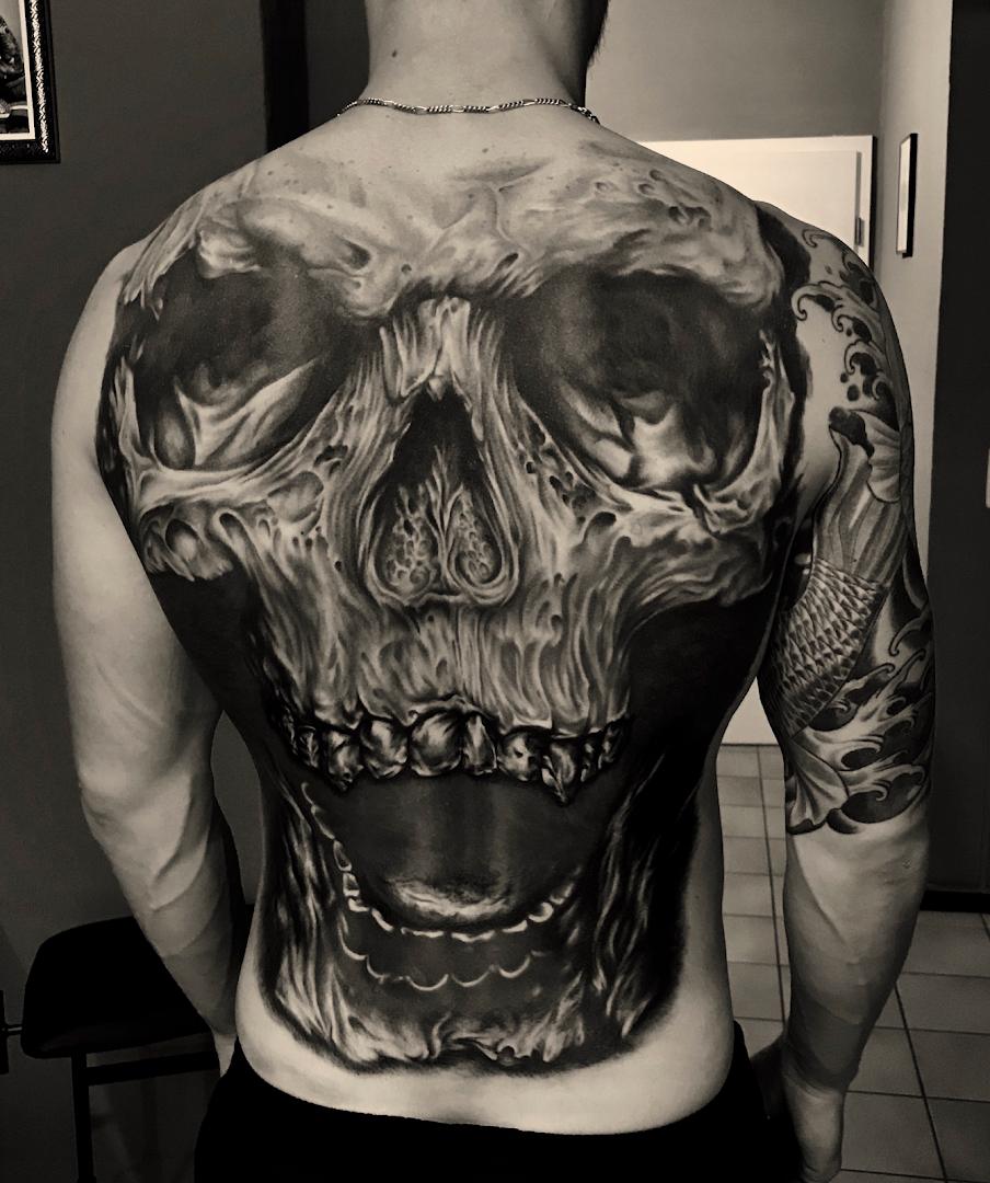 a man with a cover-up tattoo on his back, kreisfreie stadt augsburg, germany