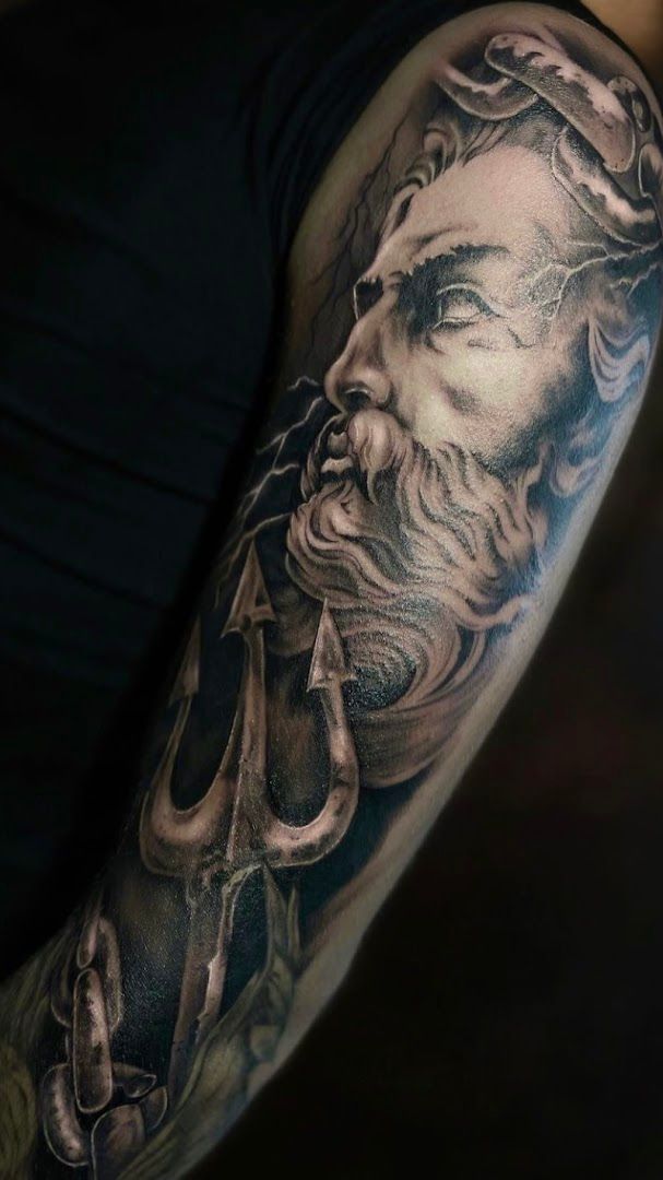 a man with a beard and a beard narben tattoo on his arm, biberach, germany