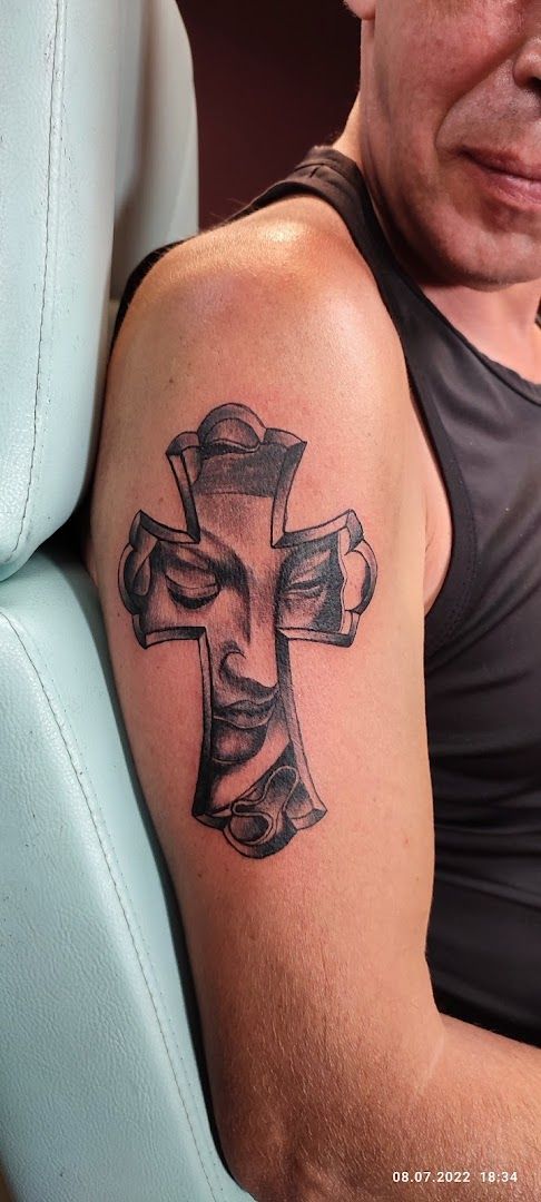 a man with a cross narben tattoo on his arm, kreisfreie stadt koblenz, germany