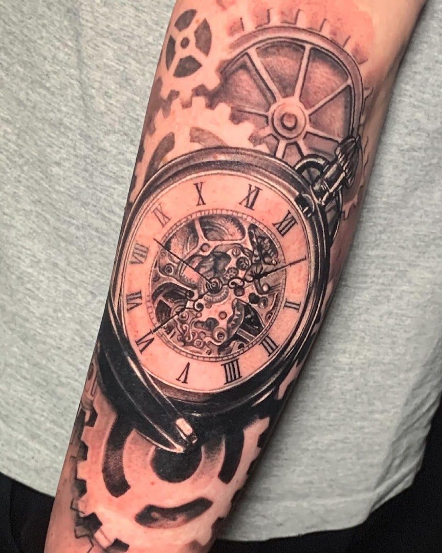 a black and white cover-up tattoo of a watch, düsseldorf, germany