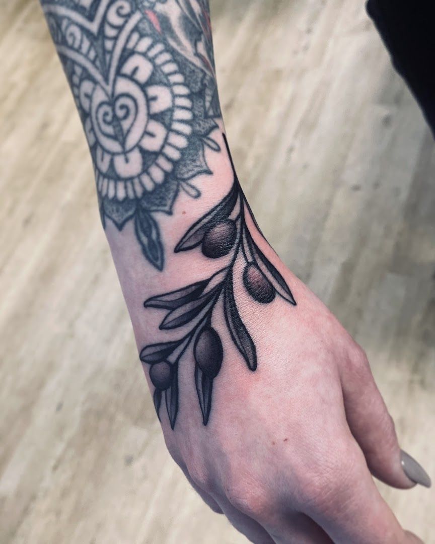 a black and white realistic tattoos on the wrist, marburg-biedenkopf, germany