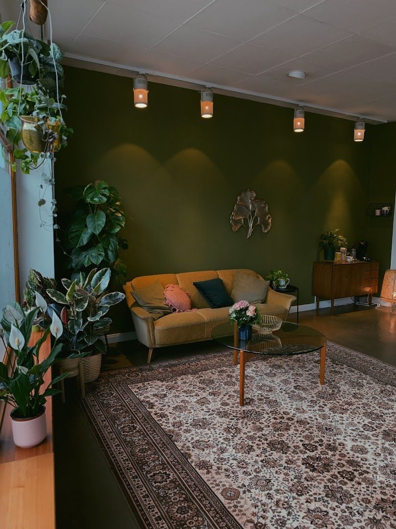 a living room with a rug and a couch