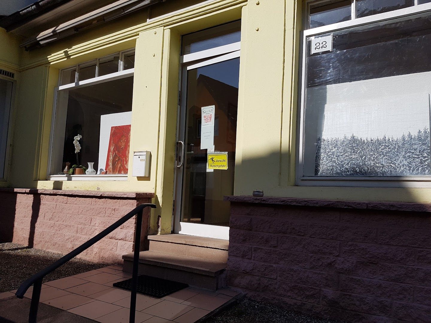 a picture of a building with a sign on the front