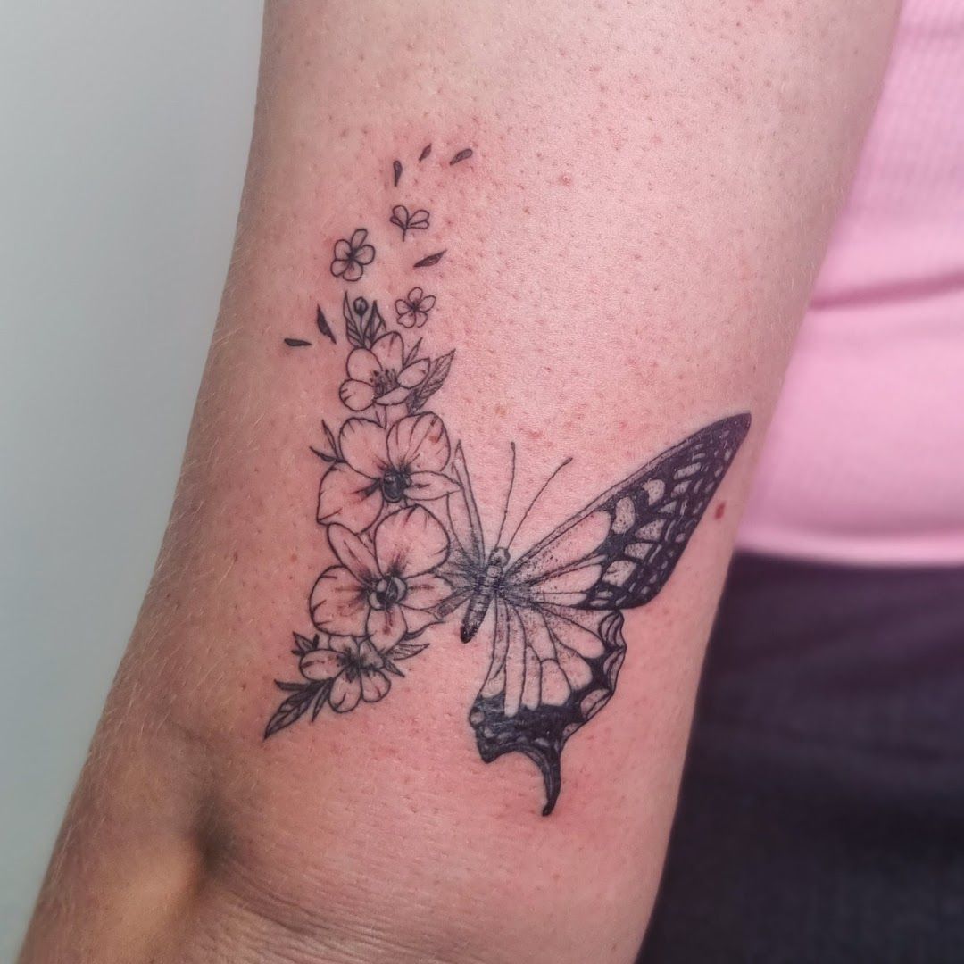 a butterfly narben tattoo on the wrist, märkischer kreis, germany