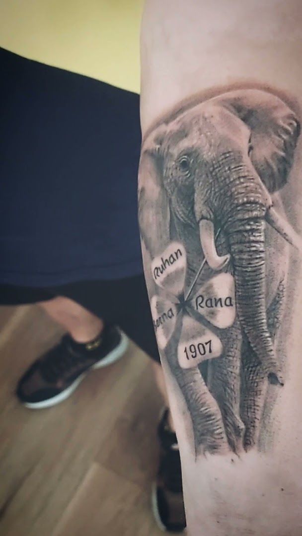 an elephant cover-up tattoo on the arm, miltenberg, germany