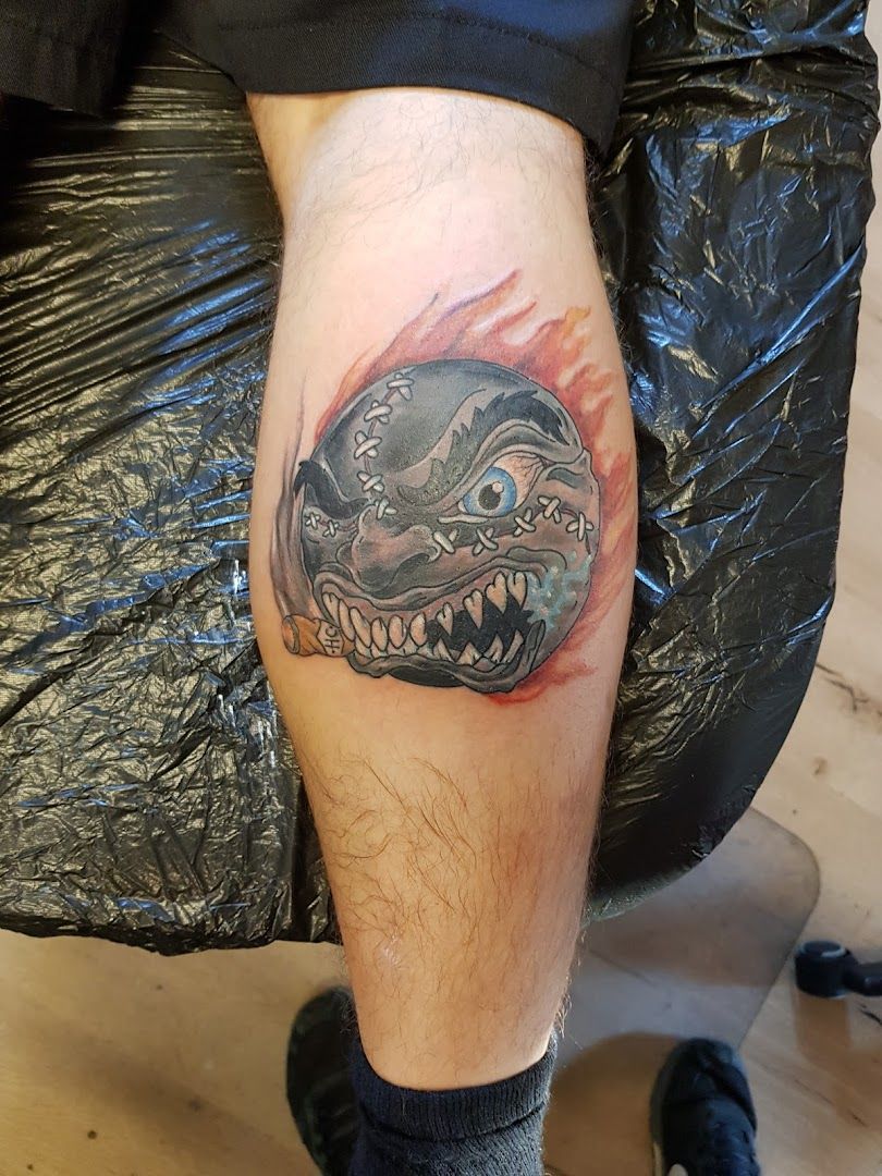 a narben tattoo of a shark with a red flame on his leg, rems-murr, germany