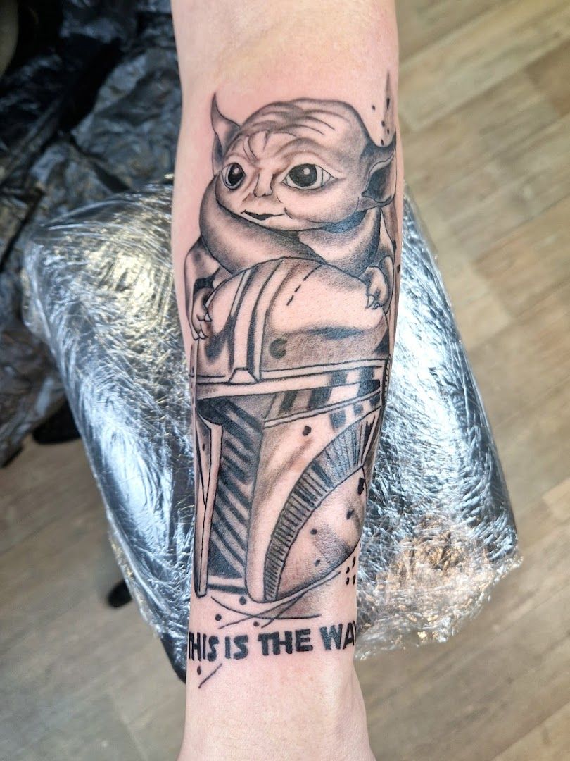 a narben tattoo of a star wars character with a helmet on his arm, emsland, germany