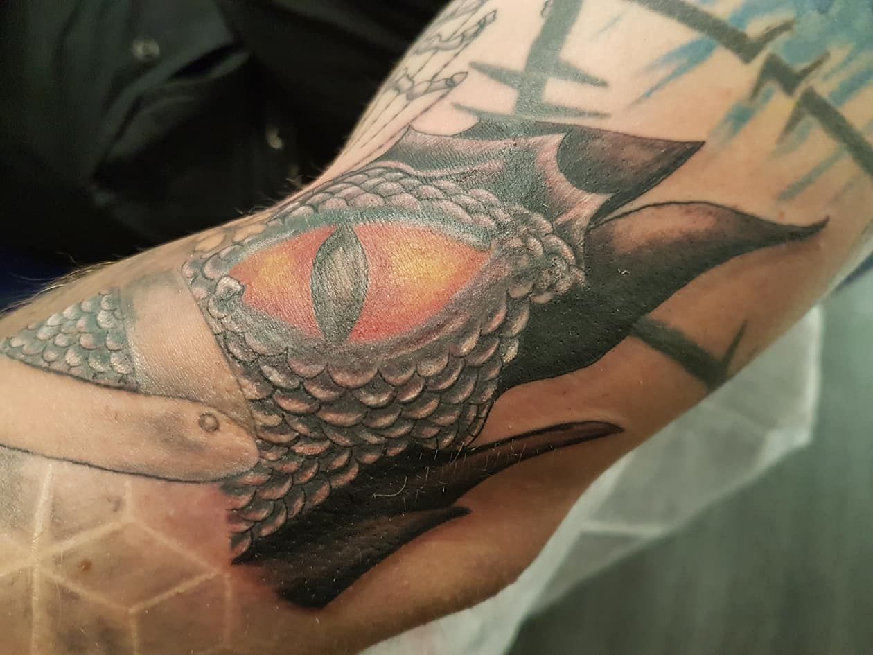 a cover-up tattoo of a bird on the arm, lippe, germany