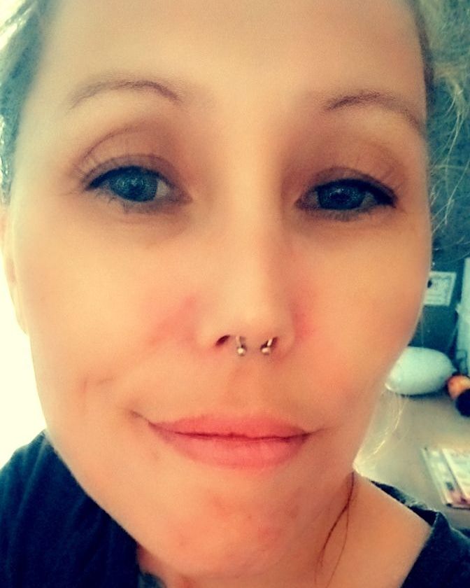 a woman with a nose piercing