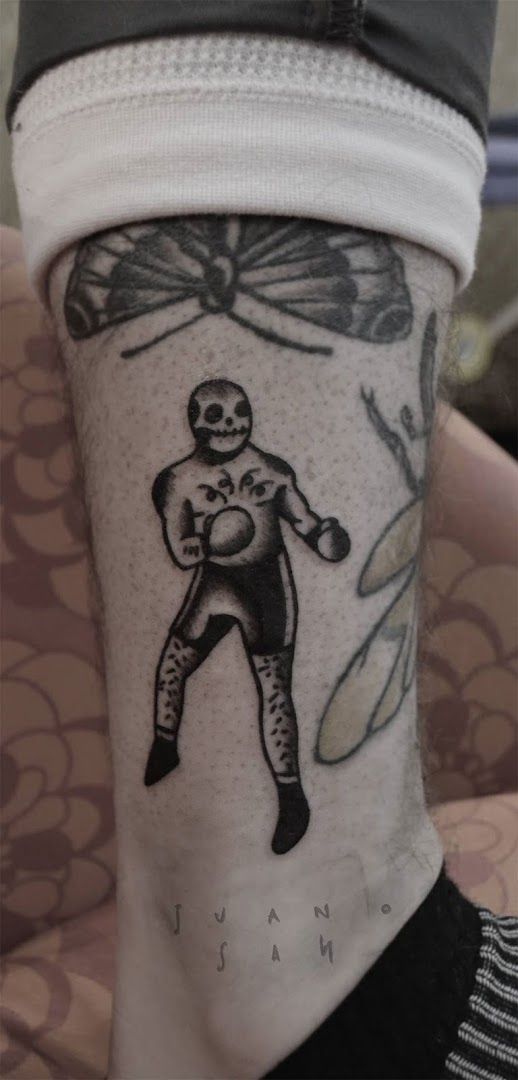 a cover-up tattoo of a man with a spider on his arm, frankfurt, germany