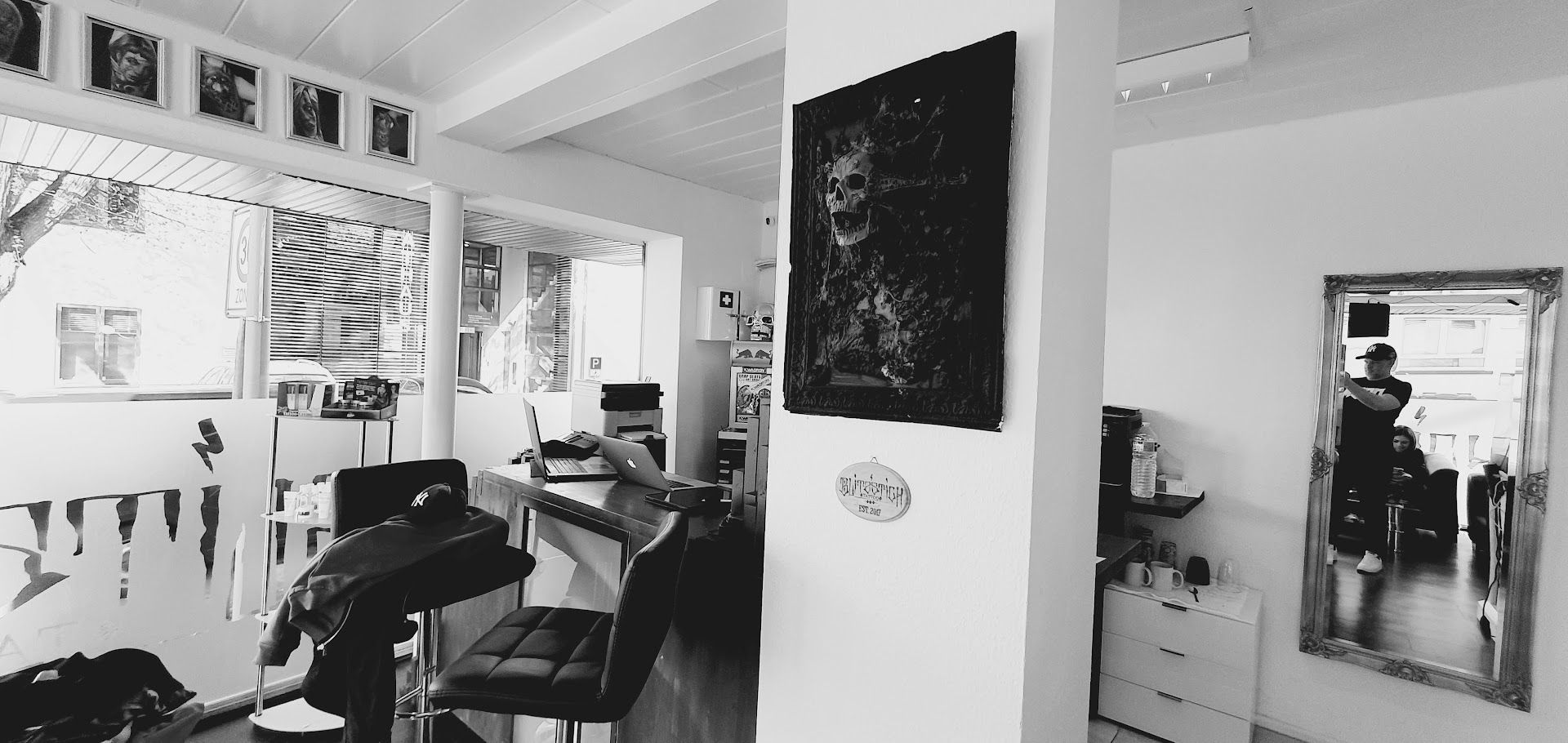 a black and white photo of a barber