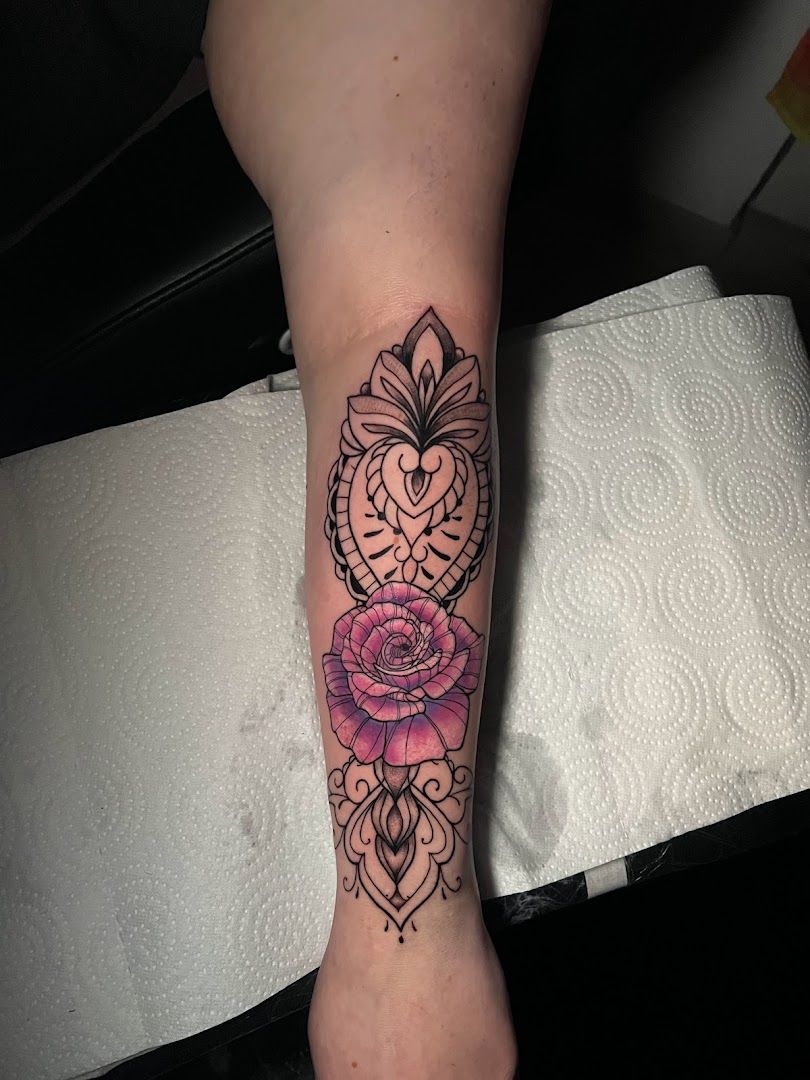 a narben tattoo with a rose on the forearm, nienburg/weser, germany