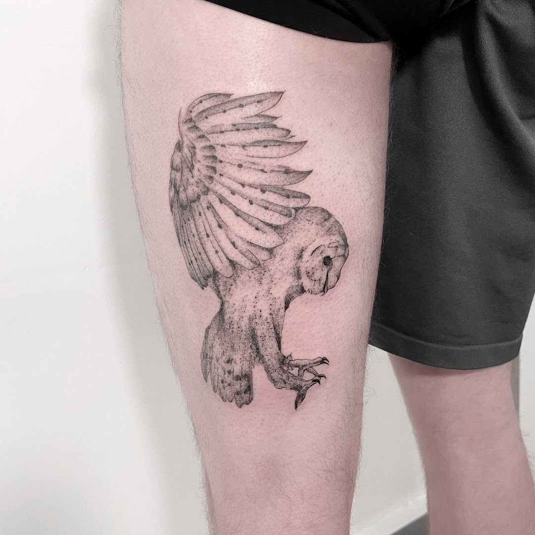 a man with a cover-up tattoo on his leg, kreisfreie stadt freiburg im breisgau, germany