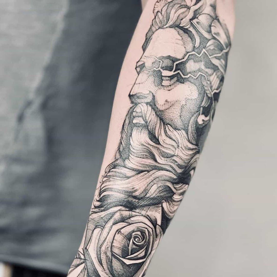 a black and white narben tattoo with roses on the arm, bonn, germany