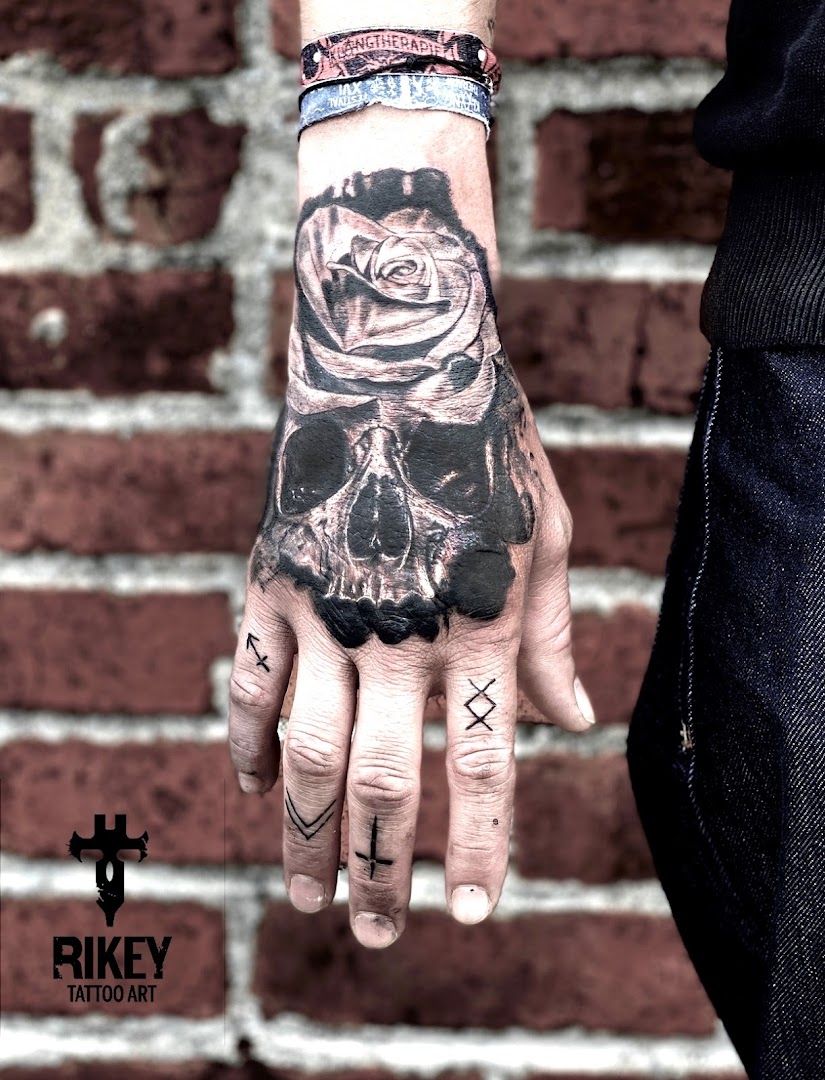 a man with a cover-up tattoo on his hand, bayreuth, germany