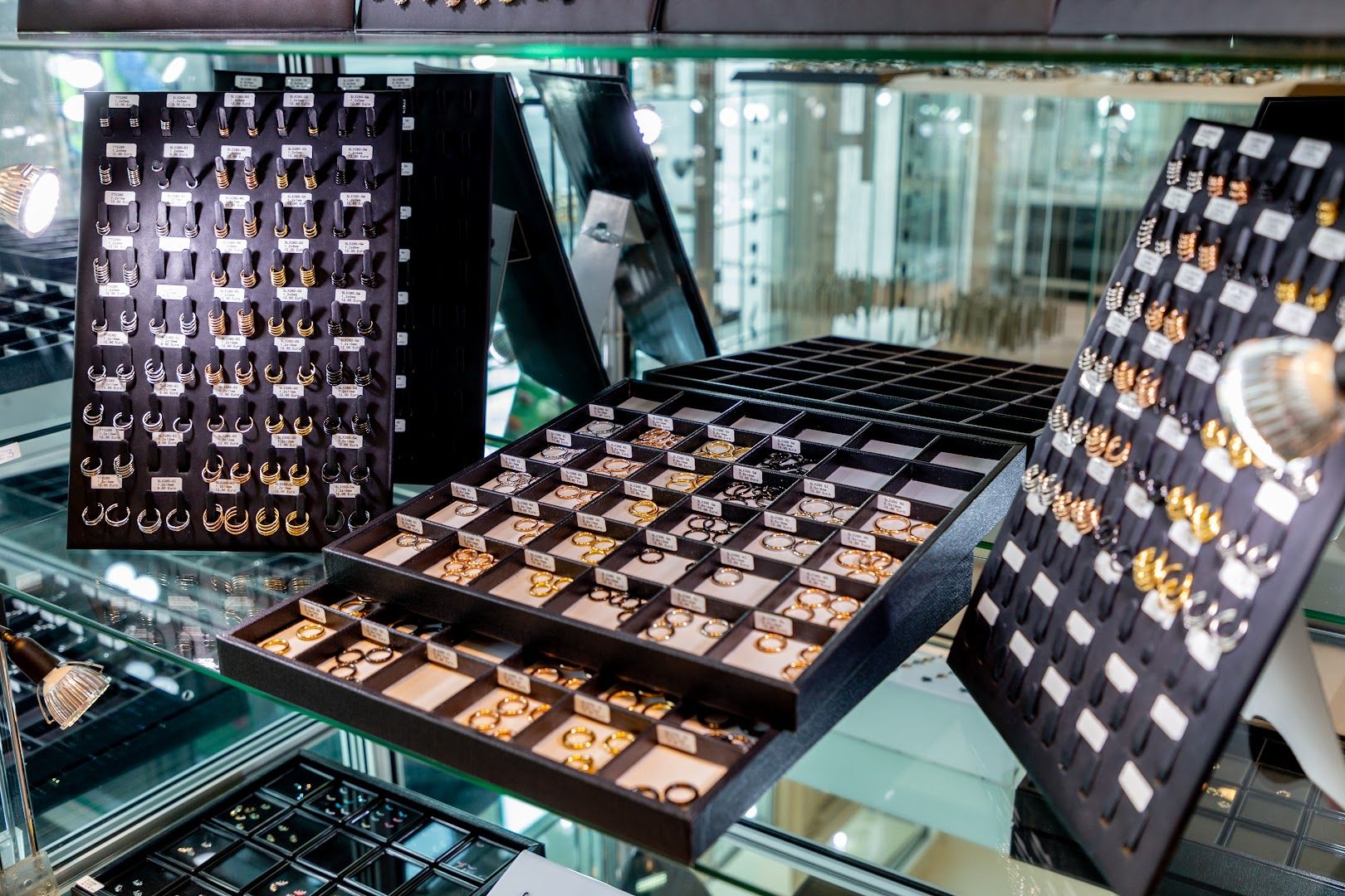 a display of jewelry in a glass case