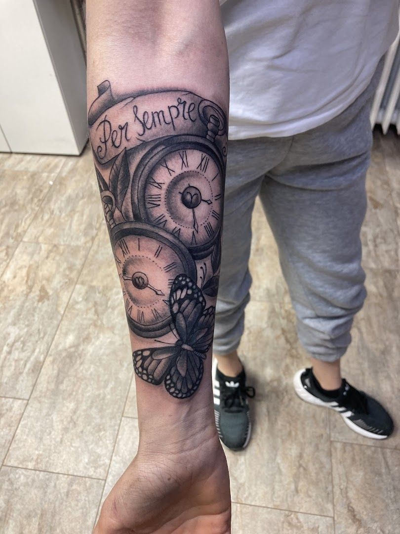 a man with a clock cover-up tattoo on his arm, reutlingen, germany