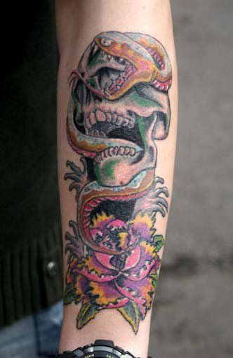 a narben tattoo of a skull and a skull with a flower on the arm, oberbergischer, germany