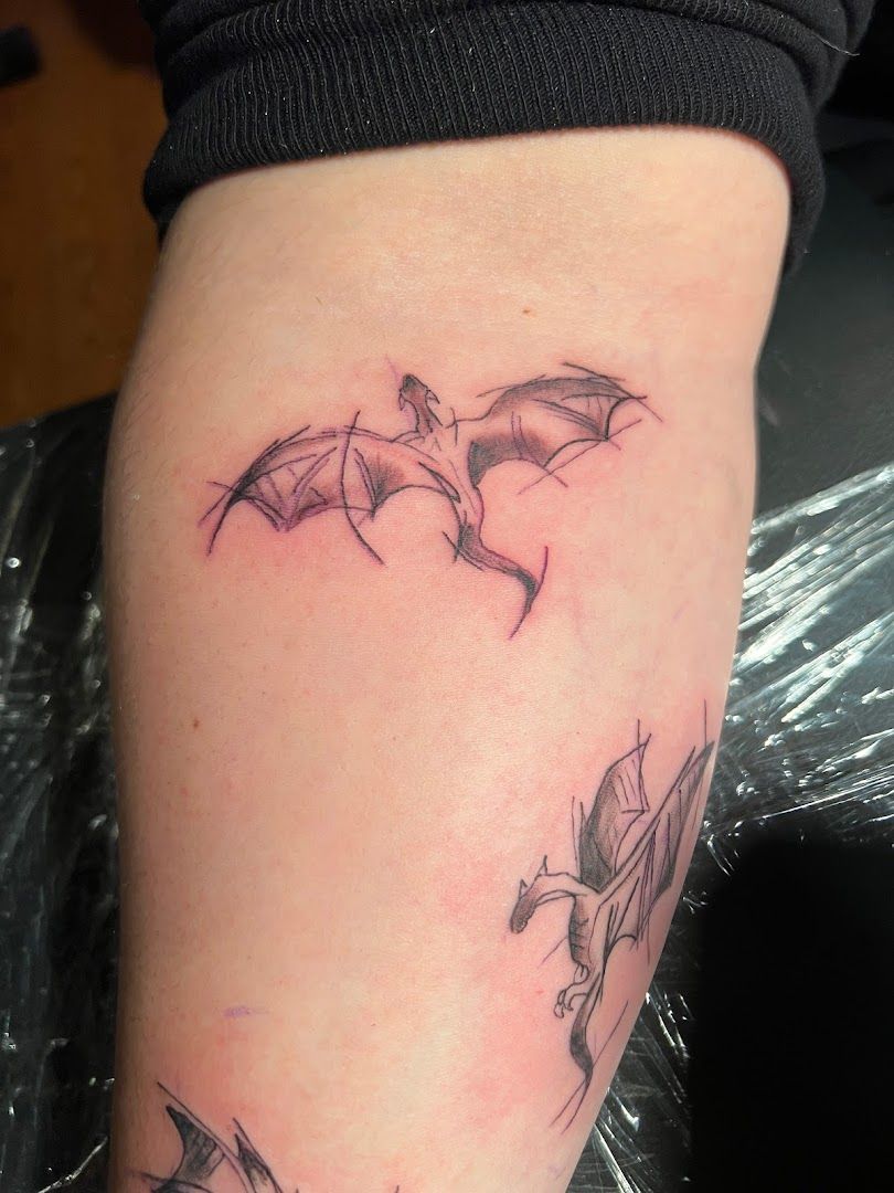 a narben tattoo of two bats on the arm, northeim, germany