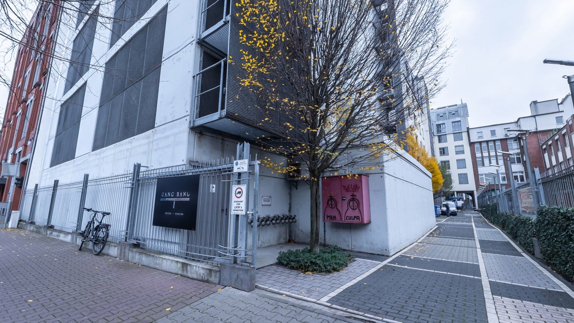 a building with a tree in front of it