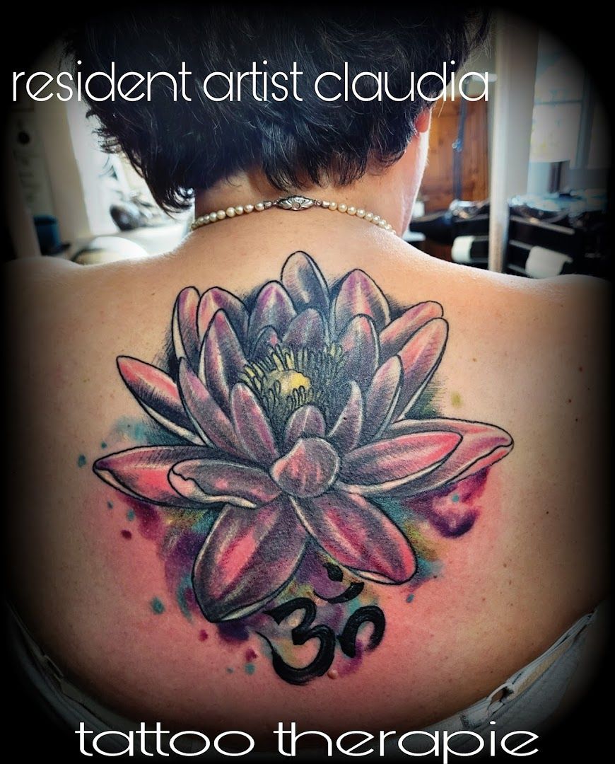 a woman with a lotus narben tattoo on her back, schleswig-flensburg, germany