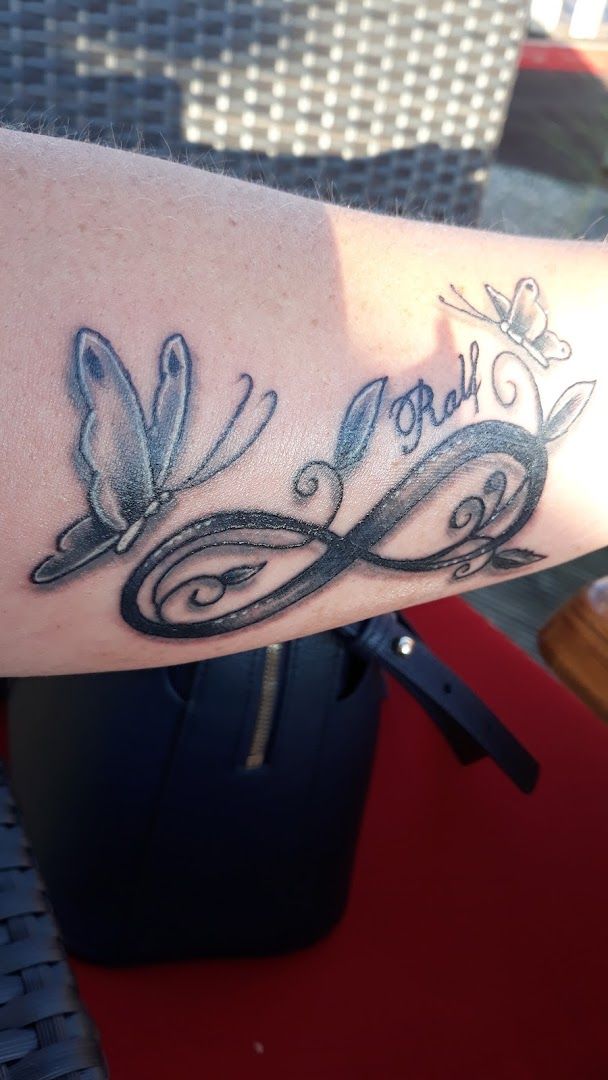 a narben tattoo with the word love on it, birkenfeld, germany