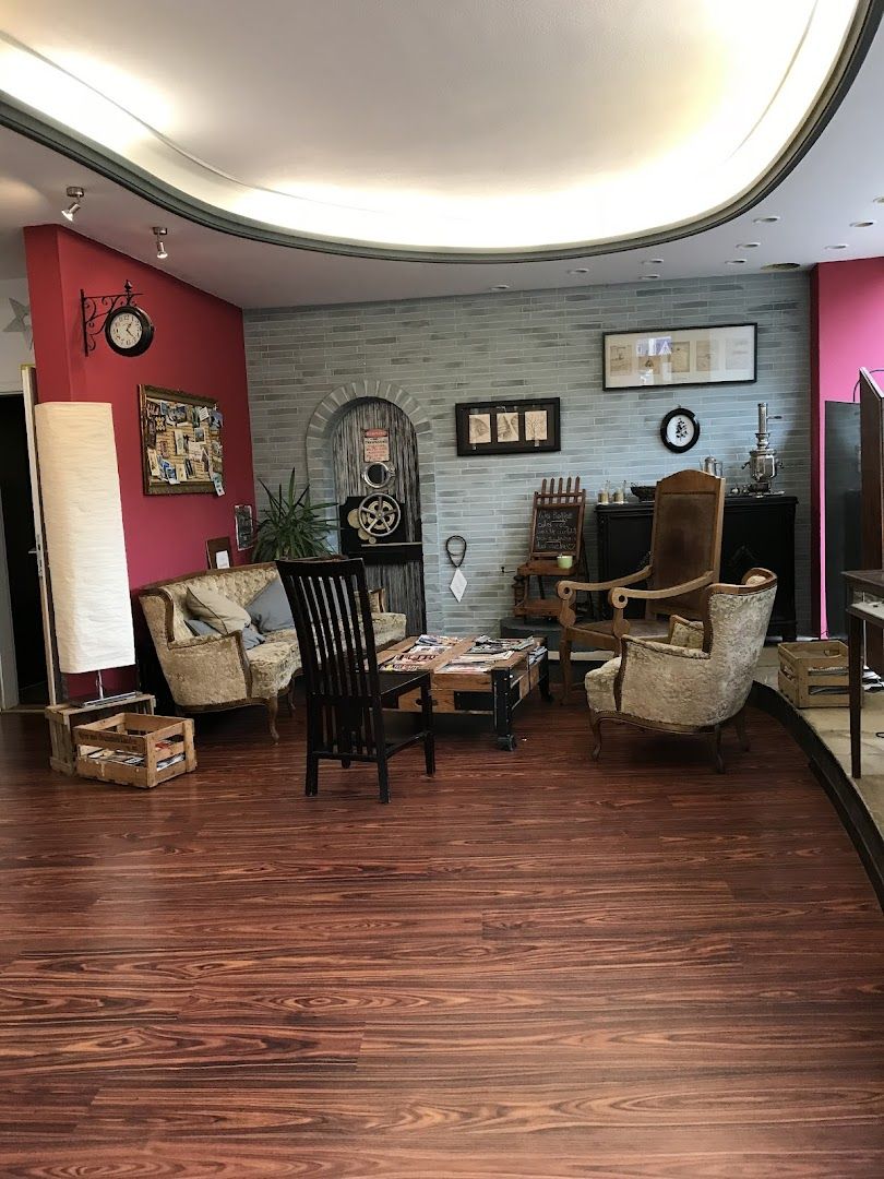 a room with a wooden floor and a large mirror