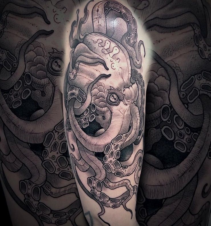 a man's arm with a narben tattoo of a clock and tentacles, bodenseekreis, germany
