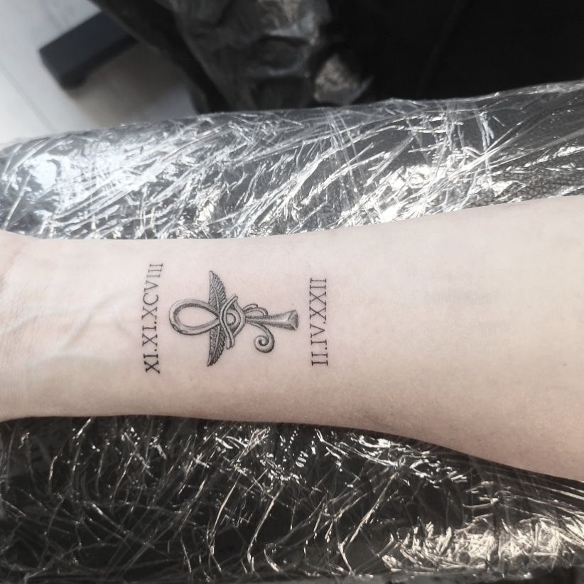 a narben tattoo with a cross and a heart on the wrist, bochum, germany