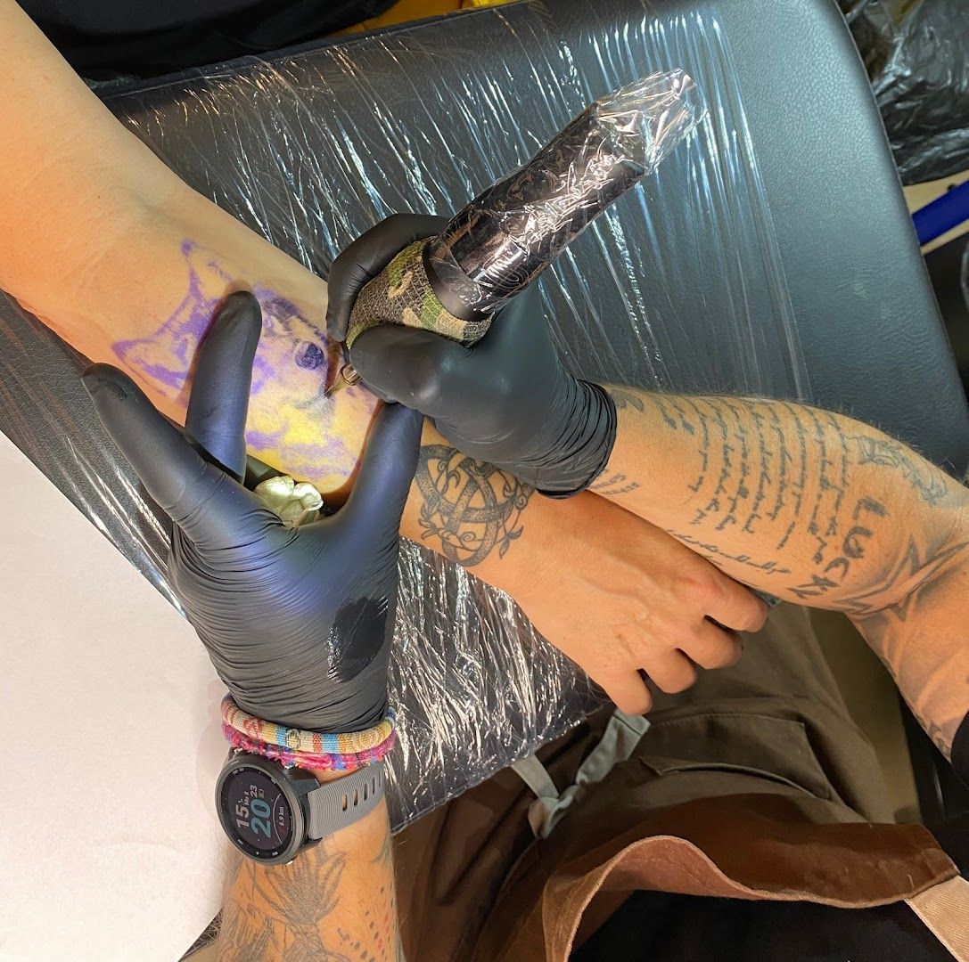 a person with totenkopf tattooss on their hands and feet, saarlouis, germany